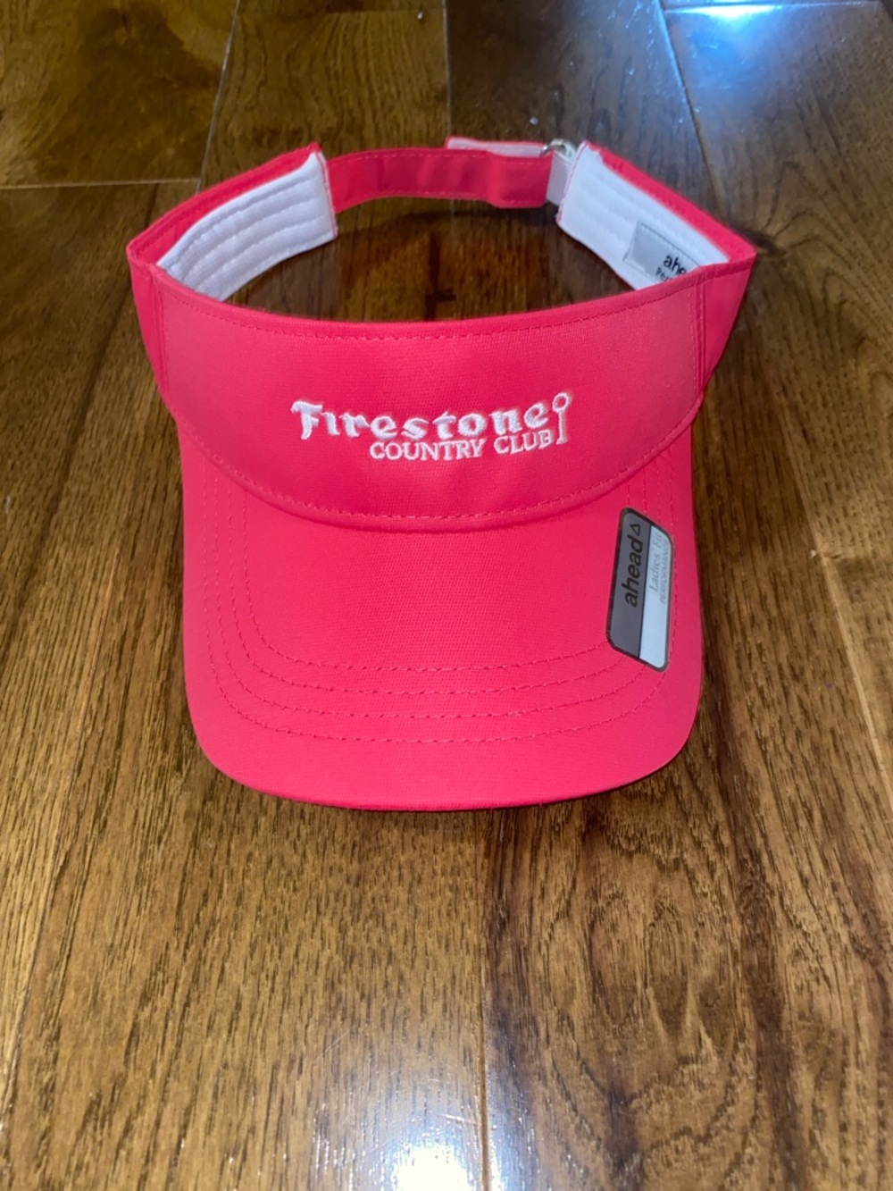 Women’s Pink Firestone Country Club visor.